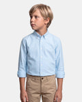 CAMISA CUELLO BOTON OXFORD LISO NIÑO CELESTE