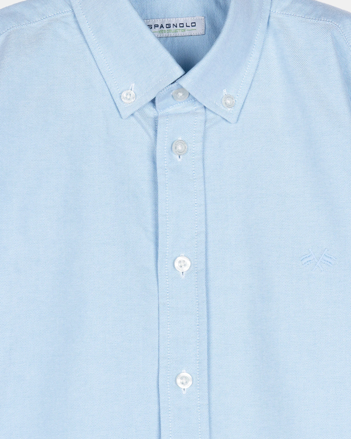CAMISA CUELLO BOTON OXFORD LISO NIÑO CELESTE